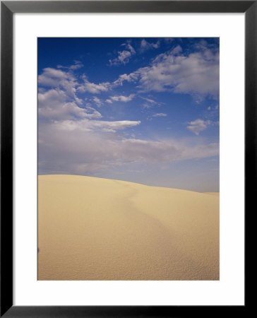 A Cloud-Filled Sky Over A Dune In White Sands National Monument by Raul Touzon Pricing Limited Edition Print image