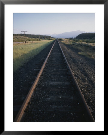 A Train Track In Colorado At Sunset by Taylor S. Kennedy Pricing Limited Edition Print image