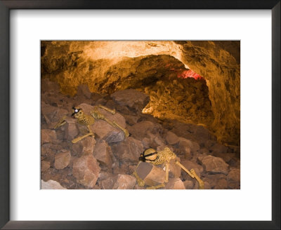 Two Skeletons Crawl Up A Rocky Hill In A Cave by Taylor S. Kennedy Pricing Limited Edition Print image