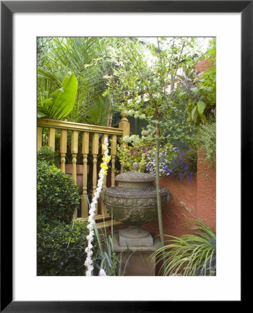 Classical Style Urn Against An Orange Painted Wall In A Small Town Garden, Bristol by Mark Bolton Pricing Limited Edition Print image