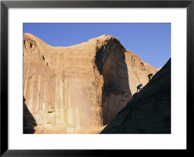 Canyoneers Explore Arch Canyon Near Rainbow Bridge In Utah by Bill Hatcher Pricing Limited Edition Print image