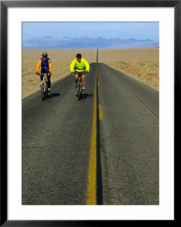 Cycling On The Ca 178 Near Badwater, Death Valley, California, Usa by Roberto Gerometta Pricing Limited Edition Print image
