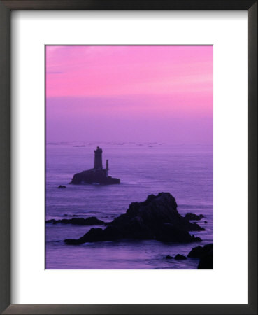 Silhouette Of Lighthouse Against Pink Sky At Sunset, Pointe Du Raz, Brittany, France by Olivier Cirendini Pricing Limited Edition Print image