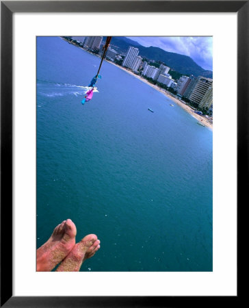 Sandy Feet Of Parasailer And High Angle View Of City, Acapulco, Mexico by Philip Smith Pricing Limited Edition Print image