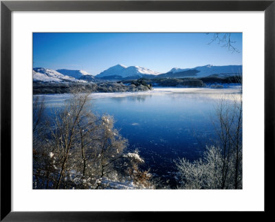 Looking Across The Partially Frozen Loch Awe To Kilchurn Castle And Ben Lui, United Kingdom by Cornwallis Graeme Pricing Limited Edition Print image