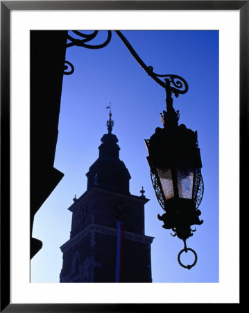 Lamp Post With Town Hall Tower (Wieza Ratuszowa) In Background, Krakow, Poland by Krzysztof Dydynski Pricing Limited Edition Print image