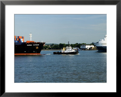 Tug Guiding A Containership Along The River Thames Near Tilbury, England by Martin Page Pricing Limited Edition Print image
