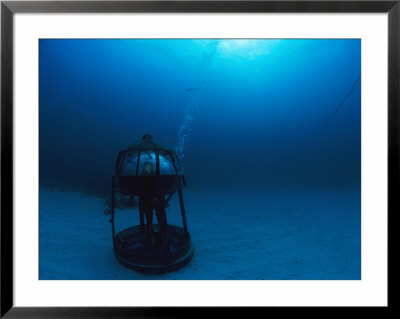 An Aquanaut Gets A Better View In An Air-Filled Rest Station by Brian J. Skerry Pricing Limited Edition Print image