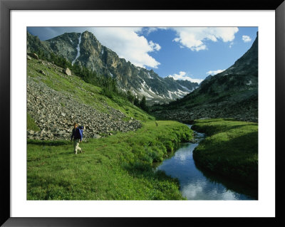 Hiker Along A Stream In A Beartooth Mountains Valley by Kate Thompson Pricing Limited Edition Print image