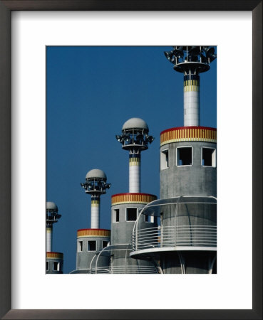 Row Of Modern Lighting Towers In Industrial Park, Barcelona, Spain by Bill Wassman Pricing Limited Edition Print image
