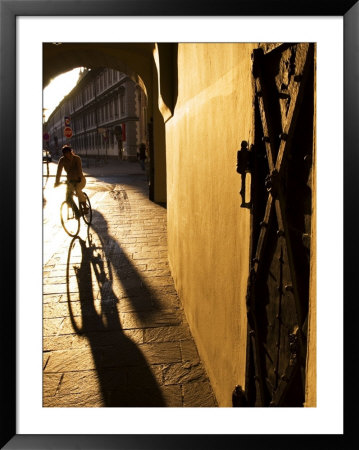 Early Morning Cyclist In Innsbruck's Altstadt (Old Town), Innsbruck, Austria by Glenn Beanland Pricing Limited Edition Print image