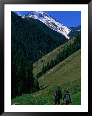 Trekkers Walk Between The Kol-Say Lakes With The Alatau Mountains Behind, Kazakhstan by Anthony Plummer Pricing Limited Edition Print image