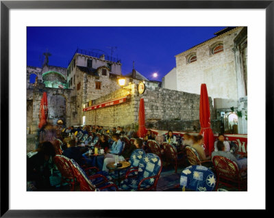 Outdoor Cafe In Decumanus At Diocletian's Palace, Split, Croatia by Wayne Walton Pricing Limited Edition Print image