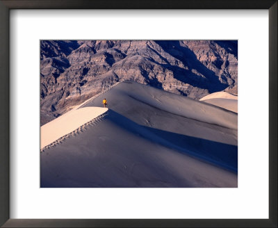 Hiker Walking On Ridge Of Eureka Sand Dunes, Death Valley National Park, Usa by Woods Wheatcroft Pricing Limited Edition Print image