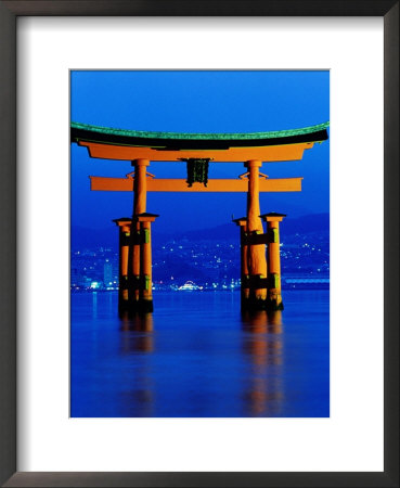 Floating Torii (Gate) At Night With City In Background, Miyajima, Japan by Frank Carter Pricing Limited Edition Print image