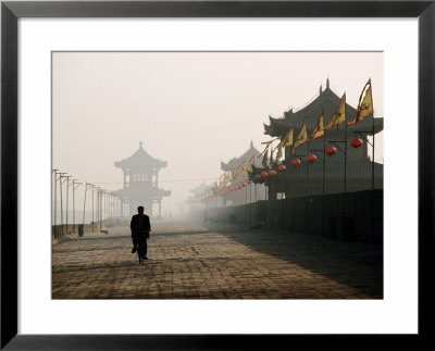 Man Walking On Ancient Wall Near North Gate, Xi'an, China by Greg Elms Pricing Limited Edition Print image