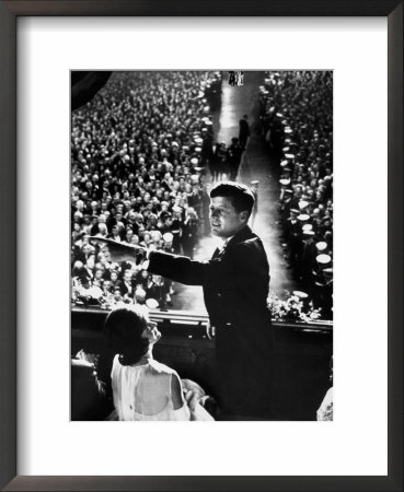 President John Kennedy Next To His Wife Jacqueline Overlooking Crowd Attending His Inaugural Ball by Paul Schutzer Pricing Limited Edition Print image