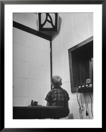 Young Boy Starring At The Loudspeaker Trying To Hear During A Medical Deafness Test by John Dominis Pricing Limited Edition Print image
