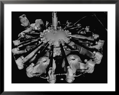 Man Working On Construction Of An Aircraft Engine by Carl Mydans Pricing Limited Edition Print image