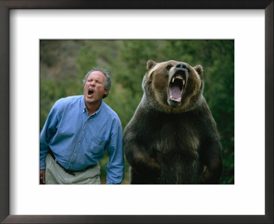 A Man And A Trained Grizzly Bear Snarl For The Camera by Joel Sartore Pricing Limited Edition Print image