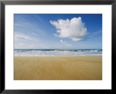 A Large Cloud Dominates The Sky As The Surf Rolls Onto A Sandy Beach by Skip Brown Pricing Limited Edition Print image