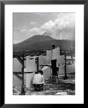 View Of Mount Vesuvius From The Town Of Torre Annunciata With Men Tending To Drying Pasta by Alfred Eisenstaedt Pricing Limited Edition Print image