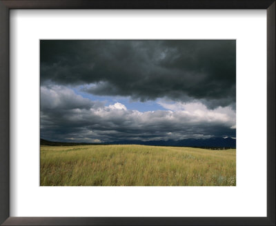 Dark Clouds Gather Over A Prairie In The National Bison Range by Annie Griffiths Belt Pricing Limited Edition Print image