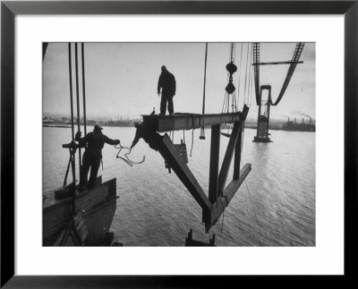 Raising The Truss, Men Of The Raising Gang Ride The Swinging Steel 160 Feet Above The Water by Peter Stackpole Pricing Limited Edition Print image