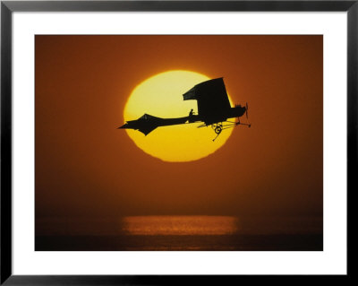 Silhouette Of Airplane Against Sun by David Doody Pricing Limited Edition Print image