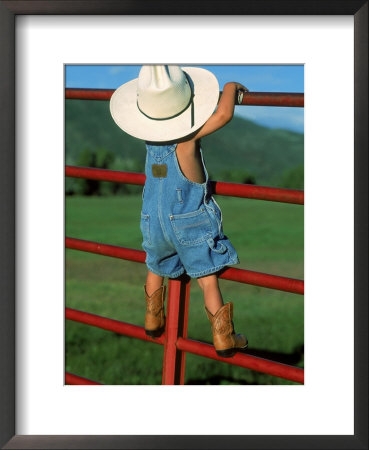 Boy In Cowboy Hat Standing On A Rail Fence by Gary Hubbell Pricing Limited Edition Print image