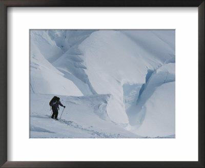 A Ski Mountaineer Above Big Crevasses In Calley Glacier by Gordon Wiltsie Pricing Limited Edition Print image