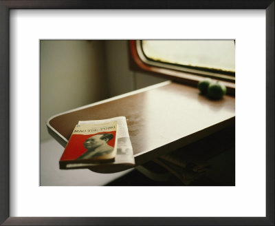 English Version Of A Biography Of Mao Sits On A Table In A Train by Eightfish Pricing Limited Edition Print image
