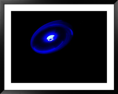 Frisbee With Attached Lights Tossed In The Air by Tim Laman Pricing Limited Edition Print image