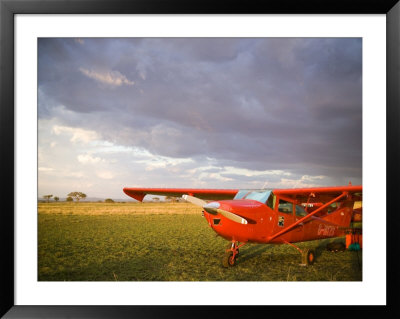 The Cessna Makes A Pit Stop To Refuel On The Serengeti, Tanzania by Michael Fay Pricing Limited Edition Print image