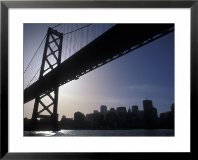Silhouette Of The Skyline And Oakland Bay Bridge, California by Rich Reid Pricing Limited Edition Print image