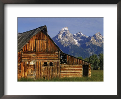 Weathered Wooden Barn Along Mormon Row With The Grand Tetons In Distance, Grand Teton National Park by Dennis Flaherty Pricing Limited Edition Print image