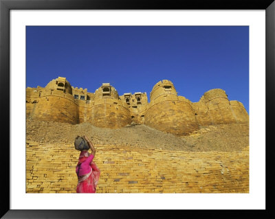 Girl In Sari Carrying Water Jar By Jaisalmer Fort, Rajasthan, India by Keren Su Pricing Limited Edition Print image