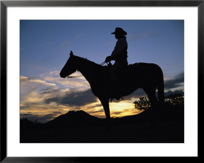 A Cowboy Silhouetted Against A Sunset At This Western Movie Location by Stephen St. John Pricing Limited Edition Print image