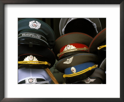 A Pile Of Communist Era Army And Police Hats For Sale As Souvenirs, Mitte, Berlin, Germany by Richard Nebesky Pricing Limited Edition Print image