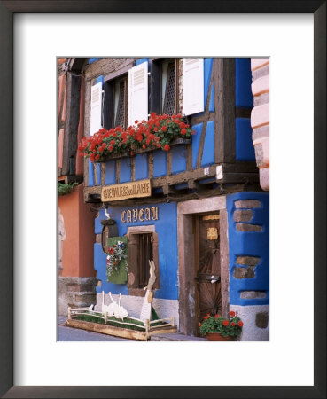 Blue House With Windowbox Full Of Geraniums, Niedermorschwihr, Haut-Rhin, Alsace, France by Ruth Tomlinson Pricing Limited Edition Print image