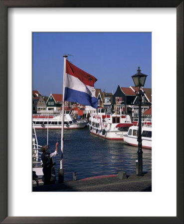 Raising The Dutch Flag By The Harbour, Volendam, Ijsselmeer, Holland by I Vanderharst Pricing Limited Edition Print image