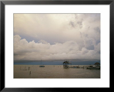 Boats Dock At Cay Caulker At Sunset by Stephen Alvarez Pricing Limited Edition Print image
