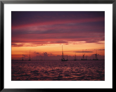 A Beautiful Cloudy Sky Is Tinted A Combination Of Reds, Oranges, And Purples Just After Sunset by O. Louis Mazzatenta Pricing Limited Edition Print image