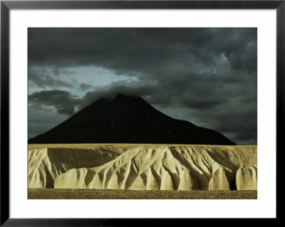 Sheer 100-Foot Cliffs Of Eroded Ash Rise Before Mount Katolinat by Winfield Parks Pricing Limited Edition Print image