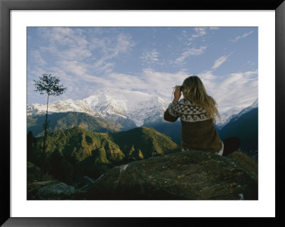 Woman With Binoculars Near The Annapurna Range, Nepal by Skip Brown Pricing Limited Edition Print image