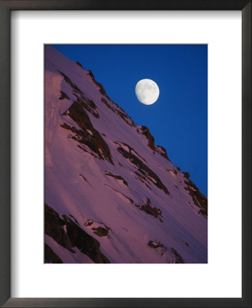 The Moon Rises Over A Snow-Covered Slope In Denali by Bill Hatcher Pricing Limited Edition Print image