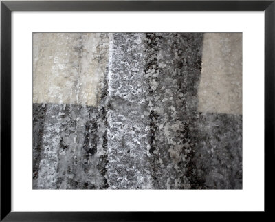 Tire Tracks And Footprints Run Through Melting Snow In A Crosswalk by Cotton Coulson Pricing Limited Edition Print image