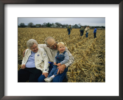 Smiling Grandparents Hold Their Grandson by Joel Sartore Pricing Limited Edition Print image