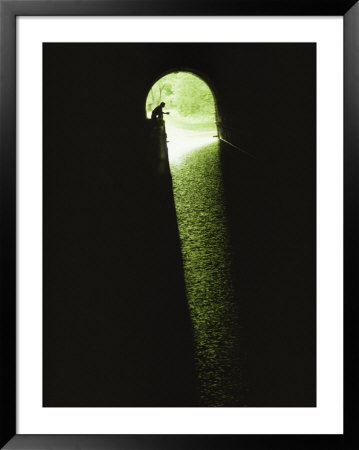 A Lone Figure At The Mouth Of The Potomac River Tunnel by Joel Sartore Pricing Limited Edition Print image