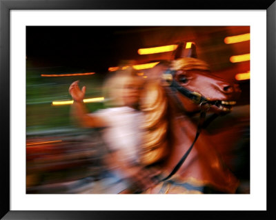 Child On Carousel At Grona Lund Amusement Park, Stockholm, Sweden by Nancy & Steve Ross Pricing Limited Edition Print image